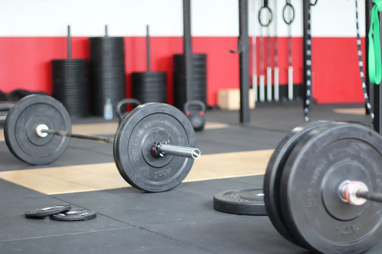 Loaded barbells on a gym floor